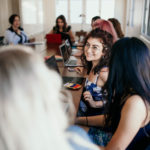 Women sitting around a meeting table (photo credit Junior League of San Diego)